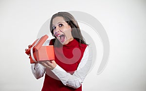 Beautiful woman opening a Christmas gifts photo
