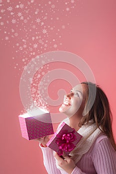 Beautiful woman opens present