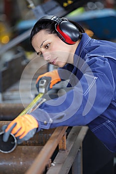 Beautiful woman operator technologist monitors process