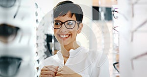 Beautiful woman with optician trying eyeglasses