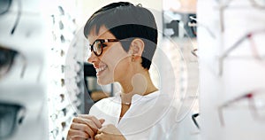 Beautiful woman with optician trying eyeglasses