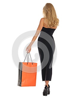 Beautiful woman with orange shopping bags