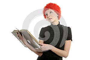 Beautiful woman, orange wig reading old book