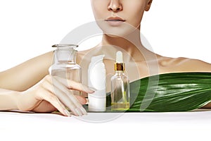 Beautiful woman with Organic Cosmetic, Oils for Beauty Treatment. Spa and Wellness. Model with clean skin. Healthcare