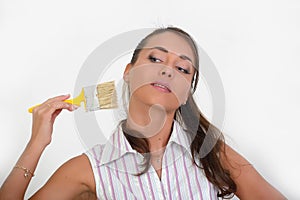 Beautiful woman painting a wall