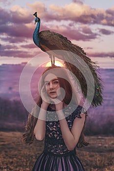 Beautiful woman with peacock photoshoot photo