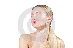 Beautiful woman with perfect skin and arrows on face, getting lifting massage using roller massager