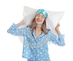 Beautiful woman with pillow and sleep mask on background. Bedtime