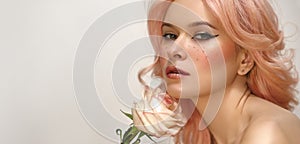 Beautiful woman with pink hair and fashion make-up. Blonde Female Model with perfect Fresh Clean Skin, Blush Rouge