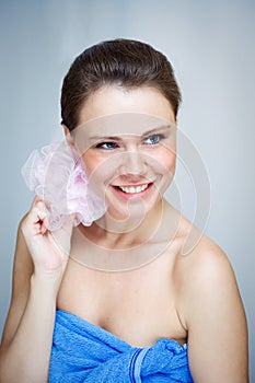 Beautiful woman with pink sponge