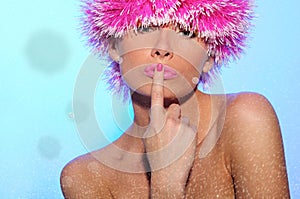 Beautiful woman in pink wig, with snow