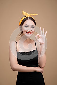 Beautiful woman pinup style portrait. Asian woman hands gesture