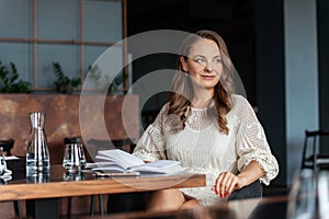 Beautiful woman plans work for day or month