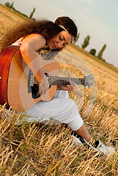 Beautiful woman playing gitar