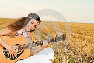 Beautiful woman playing gitar