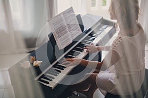 Beautiful woman playing piano