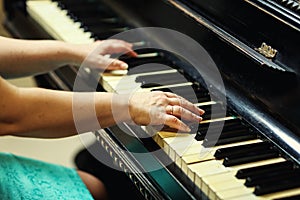 Beautiful woman playing piano,Close up of woman hands playing pi