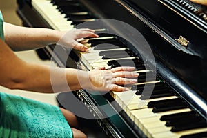 Beautiful woman playing piano,Close up of woman hands playing pi