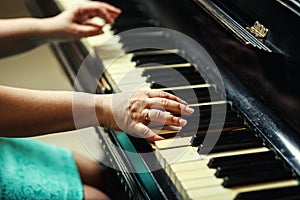 Beautiful woman playing piano,Close up of woman hands playing pi