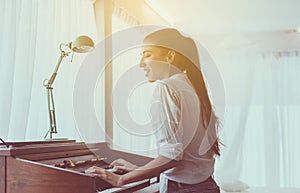 Beautiful woman playing piano,Happy and smiling,Relax time