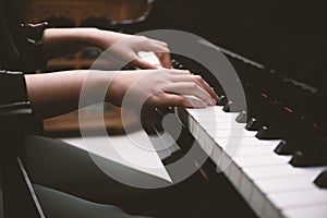 Beautiful woman playing piano, learn to play piano