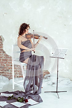 Beautiful woman playing the violin