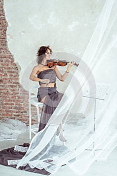 Beautiful woman playing the violin
