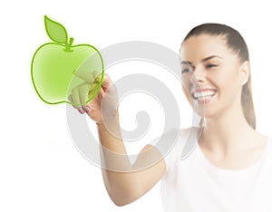 Beautiful woman pointing at an apple, healthy food choice