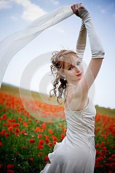 Beautiful woman in poppy field