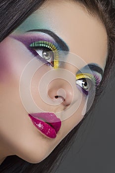 Beautiful woman portrait with bright colourful makeup