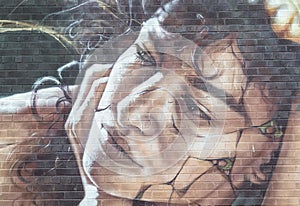 Beautiful woman portrait graffiti spray paint art. The graffiti pattern on the wall