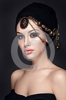 Beautiful woman portrait with headscarf on head