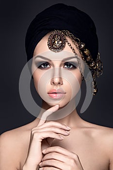 Beautiful woman portrait with headscarf on head photo