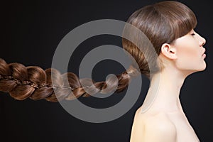 Beautiful Woman Portrait. Long Brown braid