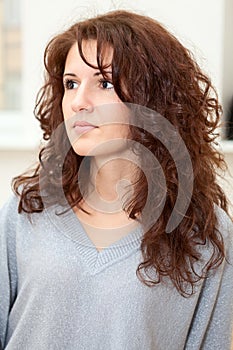 Beautiful woman portrait with long curly hair