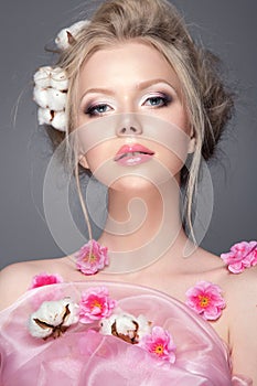 Beautiful woman portrait with spring flowers