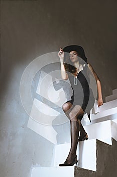 Beautiful woman pose at light stairs indoor