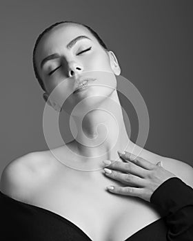 Beautiful woman pose in studio. Art portrait of a model in a bla