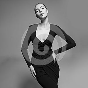 Beautiful woman pose in studio. Art portrait of a model in a bla