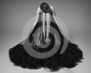 Beautiful woman pose in studio. Art portrait of a model in a bla