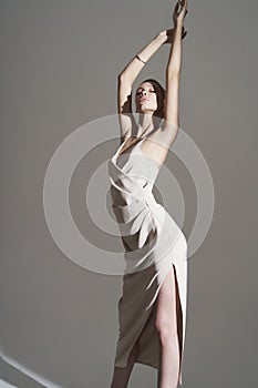 Beautiful woman pose in studio in classic dress