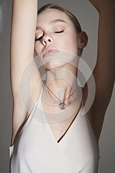 Beautiful woman pose in studio in classic dress