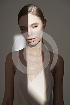 Beautiful woman pose in studio in classic dress