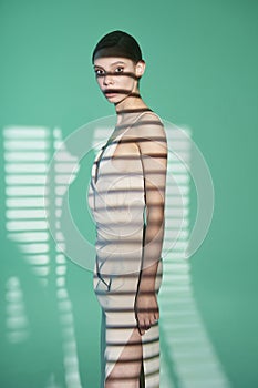 Beautiful woman pose in studio in classic dress