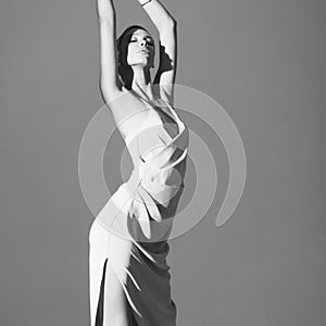 Beautiful woman pose in studio in classic dress