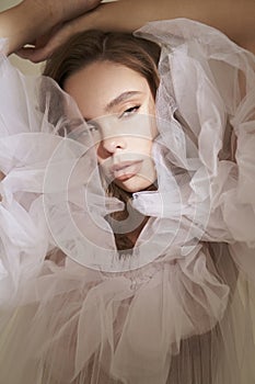 Beautiful woman pose in studio in classic wedding dress