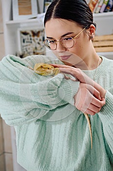 Beautiful Woman Posing with Her Adorable Bearded Dragon Pets