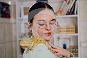 Beautiful Woman Posing with Her Adorable Bearded Dragon Pets