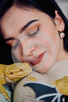 Beautiful Woman Posing with Her Adorable Bearded Dragon Pets