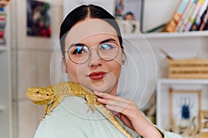 Beautiful Woman Posing with Her Adorable Bearded Dragon Pets